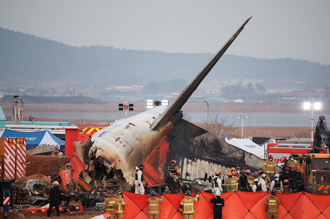 Rescue workers take part in a salvage operation at the site where an aircraft crashed after it went off the runway at Muan International Airport, in Muan, South Korea, Dec. 29, 2024. (OSV News photo/Kim Hong-Ji, Reuters)