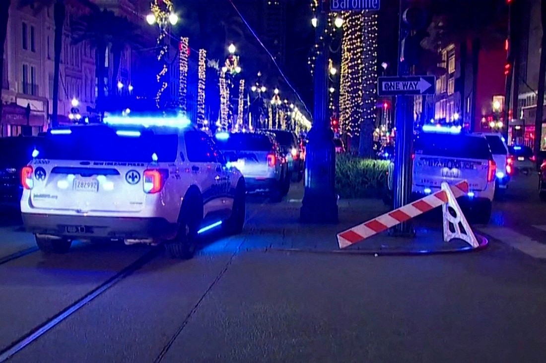 Police cars are parked at the scene where a truck drove into a large crowd on Bourbon Street in the French Quarter of New Orleans Jan. 1, 2025, in this screengrab taken from a video. A driver wrought carnage on New Orleans' famed French Quarter early on New Year's Day, ramming a pickup truck into a crowd and killing at least 10 people and injuring dozens before being shot to death by police, authorities said. (OSV News photo/ABC Affiliate WGNO/Handout via Reuters)
