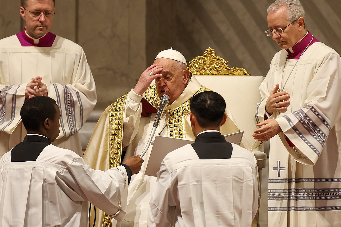 Pope Francis makes the sign of the cross during an evening prayer service in St. Peter's Basilica for New Year's Eve at the Vatican Dec. 31, 2024. (CNS photo/Lola Gomez)