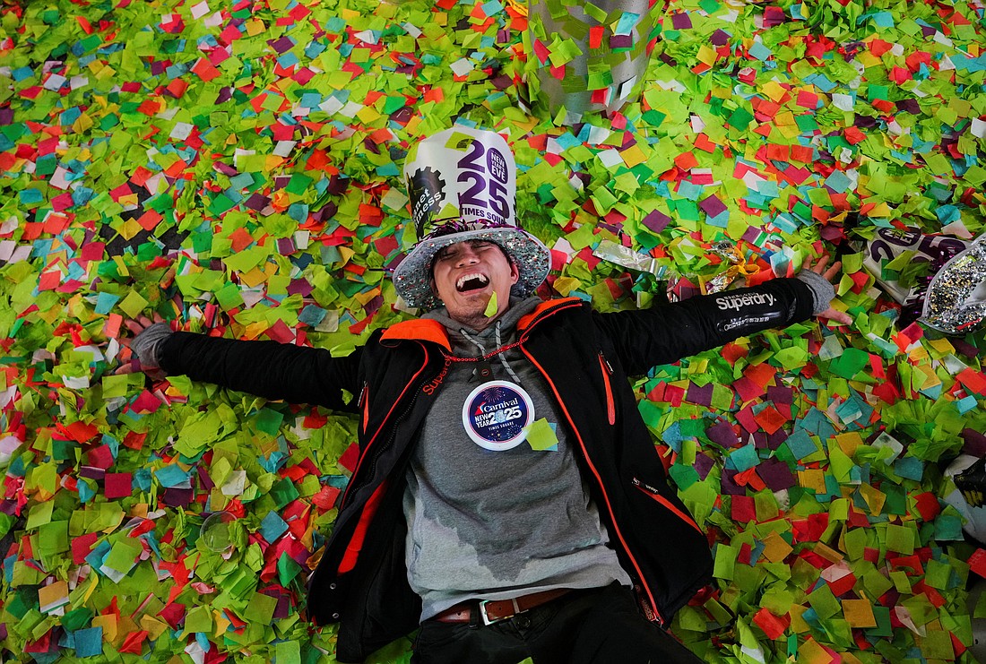 A man reacts while lying on top of confetti after the ball drop at Times Square during New Year's celebrations in New York City Jan. 1, 2025. (OSV News photo/Adam Gray, Reuters)