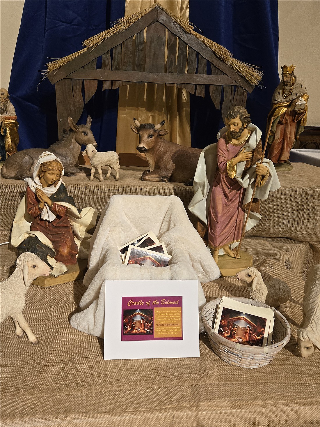 Cards with names of children mourned are collected in a cradle between Mary and Joseph in Our Lady of Good Counsel Church, Moorestown. Courtesy photo