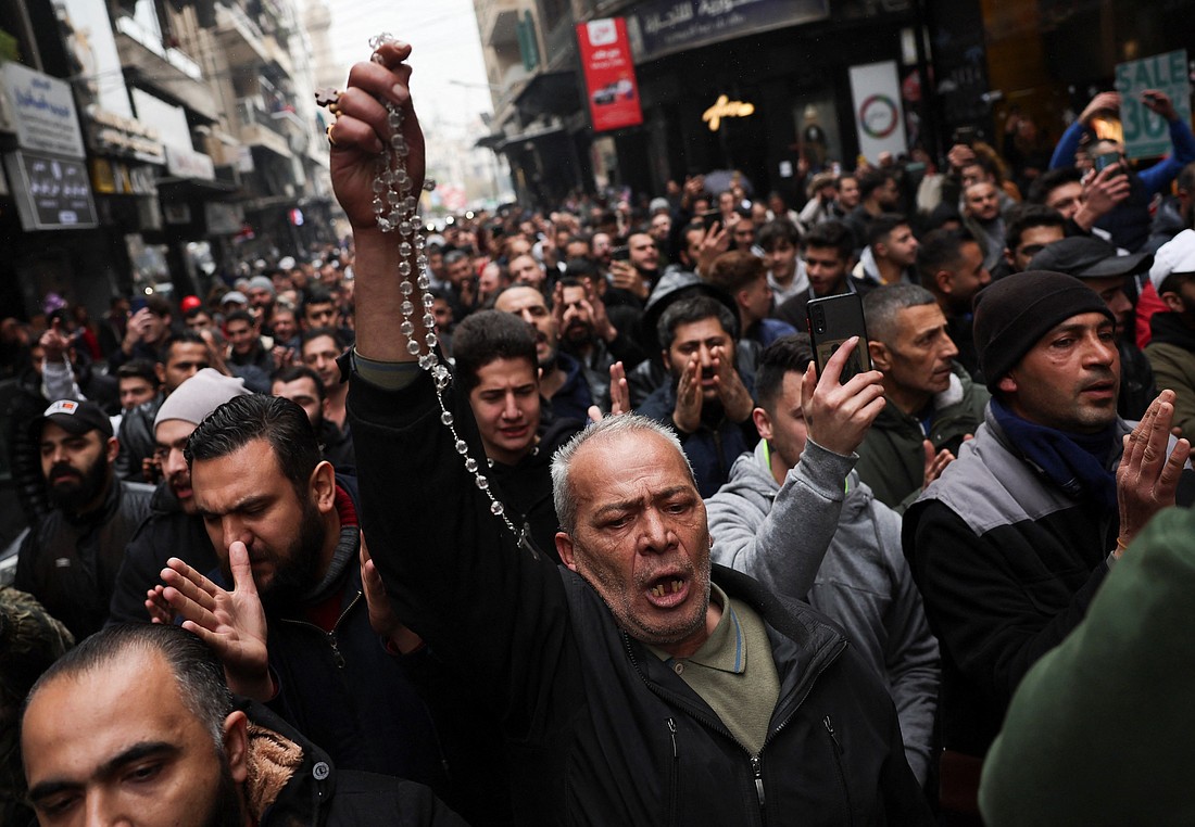 People in Damascus, Syria, attend a protest against the burning of a Christmas tree in the country's Hama governate, Dec. 24, 2024. (OSV News photo/Amr Abdallah Dalsh, Reuters)