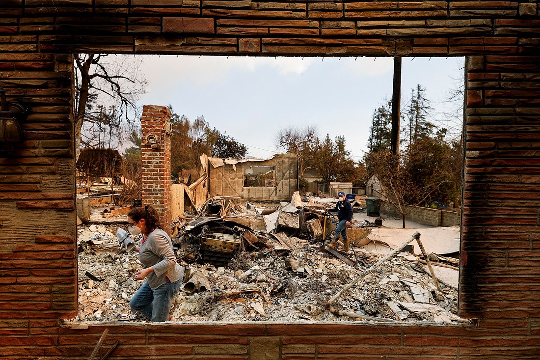 People search through the remains of a house in Altadena, Calif., Jan. 9, 2025, which was burned down by the Eaton Fire, fueled by powerful winds in the Los Angeles area. Northeast of Los Angeles in Sierra Madre, the Mater Dolorosa Passionist Retreat Center was among the many structures badly damaged by the Eaton Fire. (OSV News photo/Fred Greaves, Reuters)