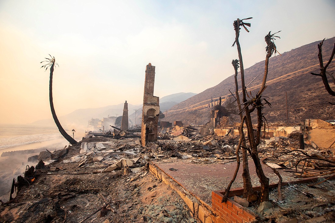 Destroyed structures are seen in Malibu, Calif., Jan. 8, 2025, as the Palisades Fire burns during a windstorm on the west side of Los Angeles. Firefighters battled early Jan. 9 to control a series of major fires in the Los Angeles area that have killed five people, ravaged communities from the Pacific Coast to Pasadena and sent thousands of people frantically fleeing their homes. (OSV News photo/Ringo Chiu, Reuters)