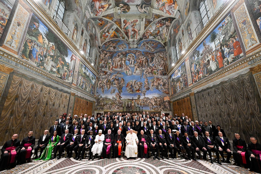 Pope Francis and ambassadors and diplomats accredited to the Holy See pose for a photo in the Sistine Chapel after their annual meeting in the Hall of Blessing in the Apostolic Palace at the Vatican Jan. 9, 2025. (CNS photo/Vatican Media)