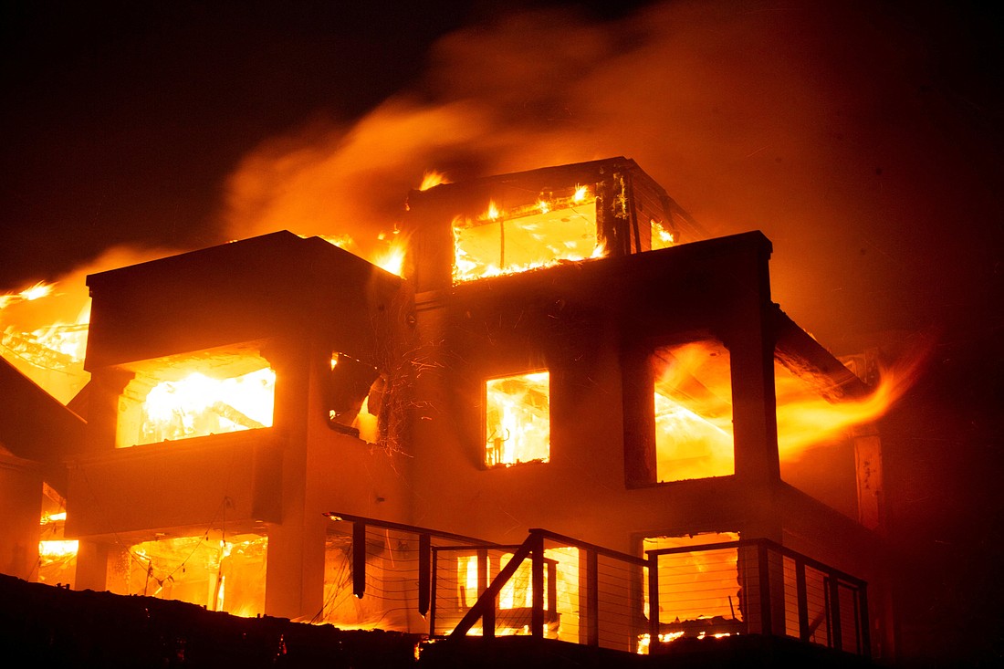 Flames rise from a structure as the Palisades Fire burns during a windstorm on the west side of Los Angeles Jan. 8, 2025. Firefighters battled early Jan. 9 to control a series of major fires in the Los Angeles area that have killed five people, ravaged communities from the Pacific Coast to Pasadena and sent thousands of people frantically fleeing their homes. (OSV News photo/Ringo Chiu, Reuters)