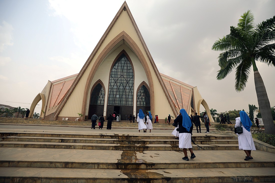 Women religious are pictured in a file photo entering a church in Abuja, Nigeria. Calls have multiplied in Nigeria for the release of two sisters, both members of the Congregation of the Immaculate Heart of Mary Mother of Christ, who were kidnapped  Jan. 7, 2025, along Ufuma Road as they returned from their vocational associations' meeting. (OSV News photo/Afolabi Sotunde, Reuters)