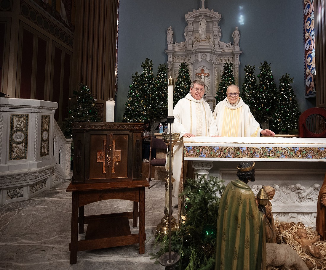 Msgr. Liam Kidney, left, and Msgr. Lloyd Torgerson are pictured at St. Monica Church with the tabernacle recovered Jan. 11, 2025, from Corpus Christi Church, where Msgr. Kidney is pastor. Some days after Corpus Christi was incinerated by the Palisades Fire, Capt. Bryan Nassour of the LA Fire Department crawled through the rubble and found the tabernacle intact. (OSV News photo/Victor Alemán, Angelus)