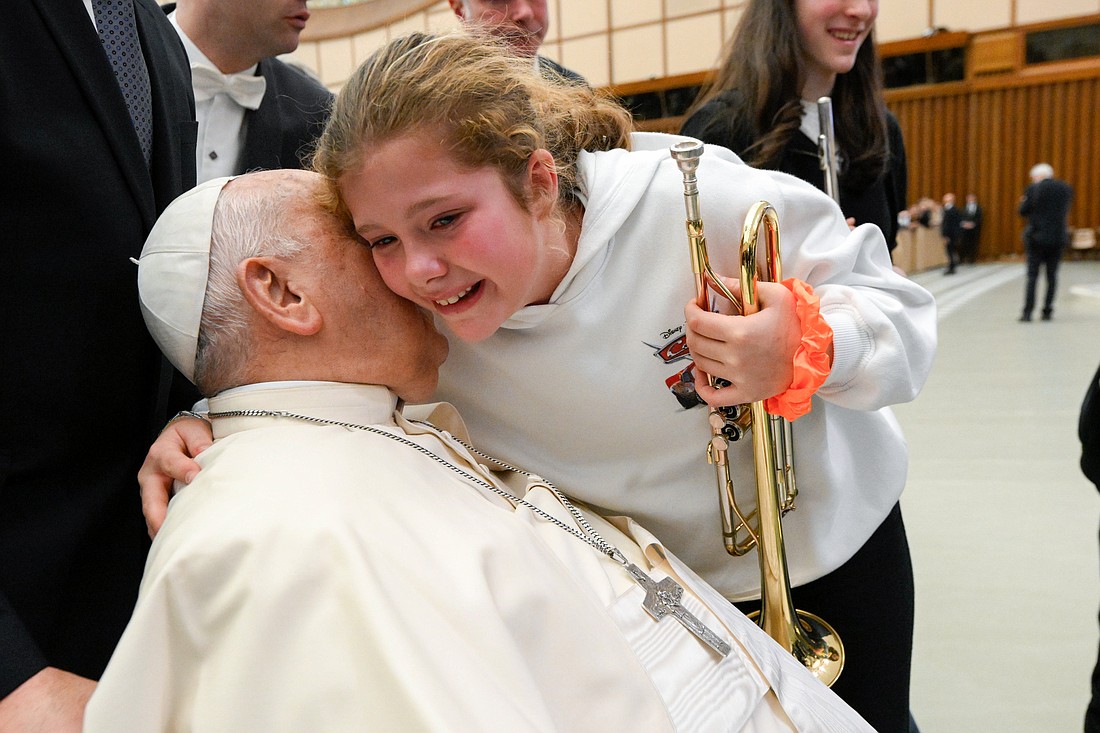 Pope Francis greets a young person at the conclusion of the first of his Saturday general audiences for the Holy Year in the Paul VI Audience Hall at the Vatican Jan. 11, 2025. (CNS photo/Vatican Media)