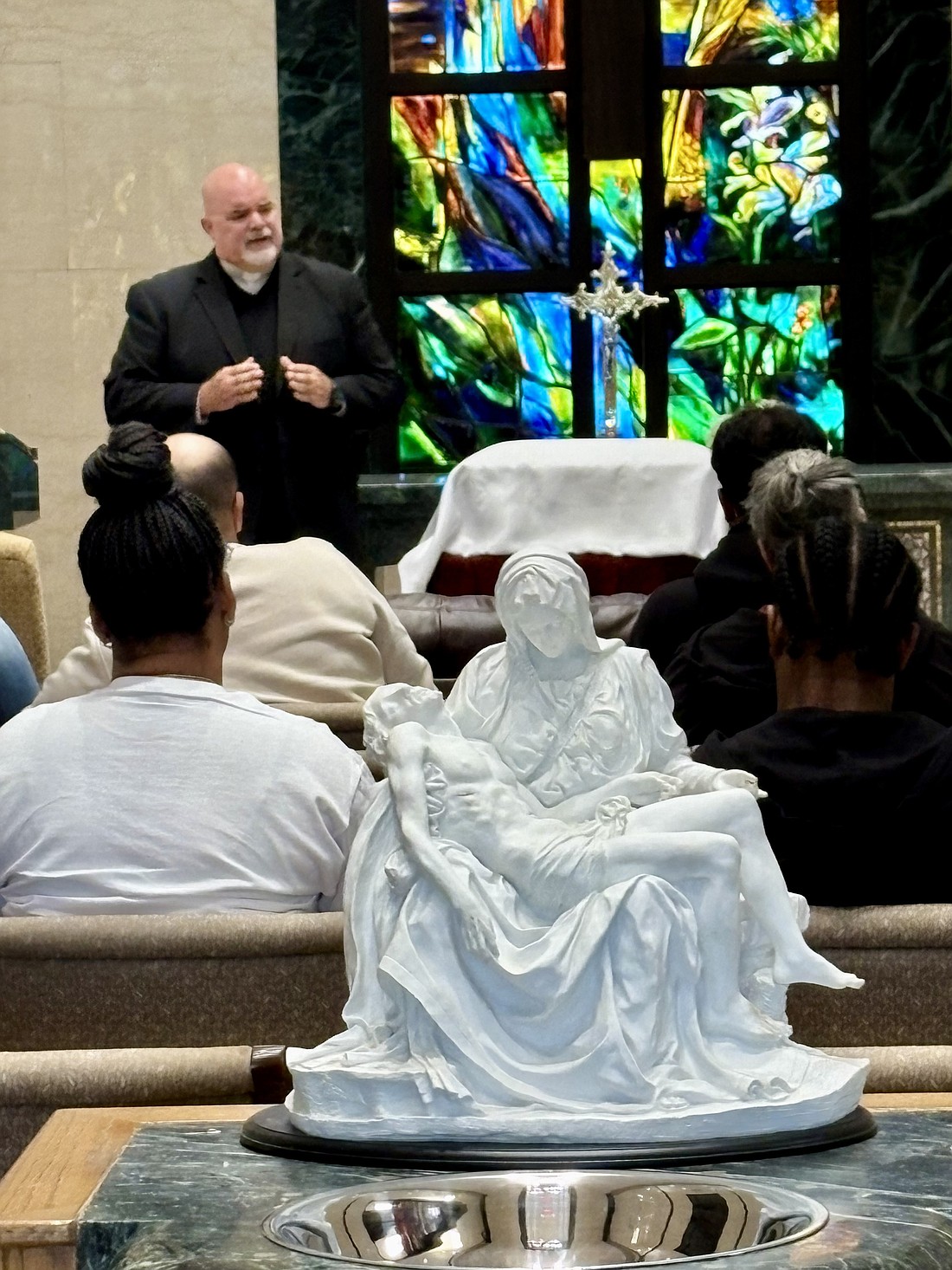 At a committal service at Jesus Bread of Life Mausoleum with Bradley Funeral Home and Virtua Health System, Deacon O’Connor speaks to bereaved families. Photo courtesy of Jesus Bread of Life Cemetery