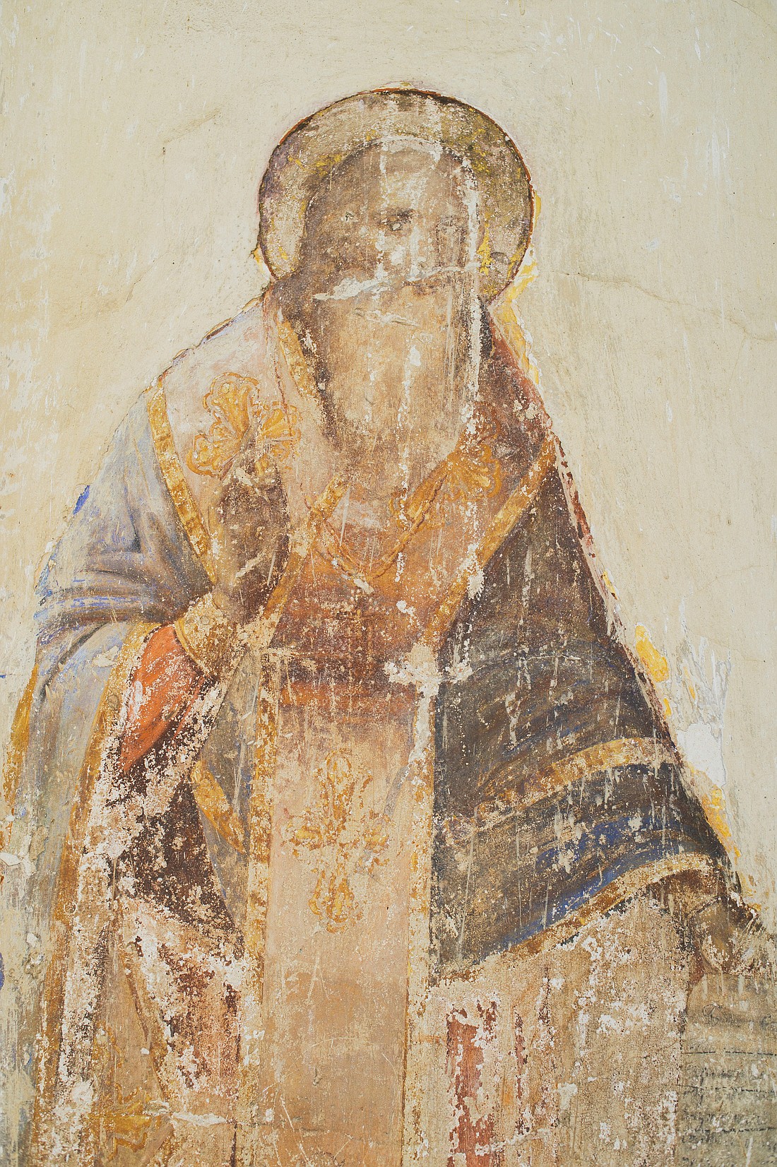 This photo from Egor Myznik, on Unsplash, is of an antique fresco depicting a saint painted on the wall of a Russian Orthodox church.