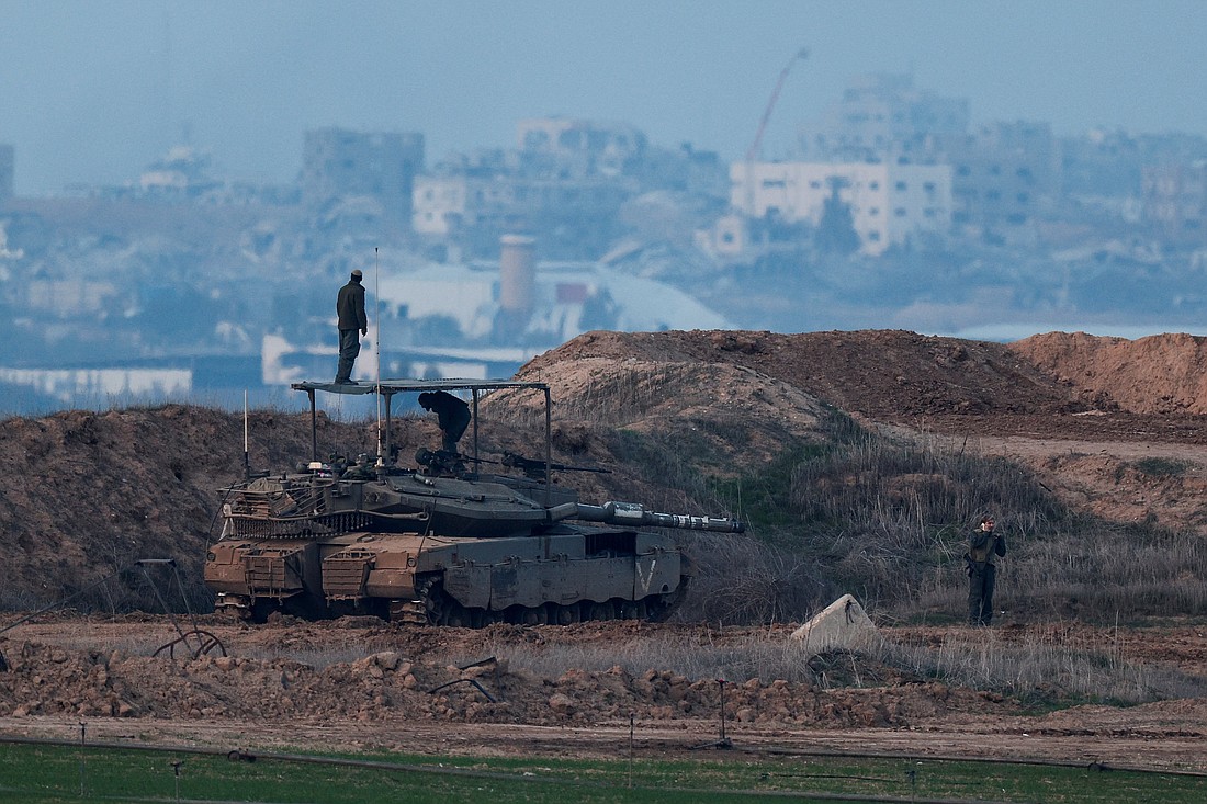 Israeli soldiers, seen from the Israel's side of the border with Gaza, stand on a tank ahead of a ceasefire agreement between Israel and Hamas Jan. 15, 2025. (OSV News photo/Amir Cohen, Reuters)