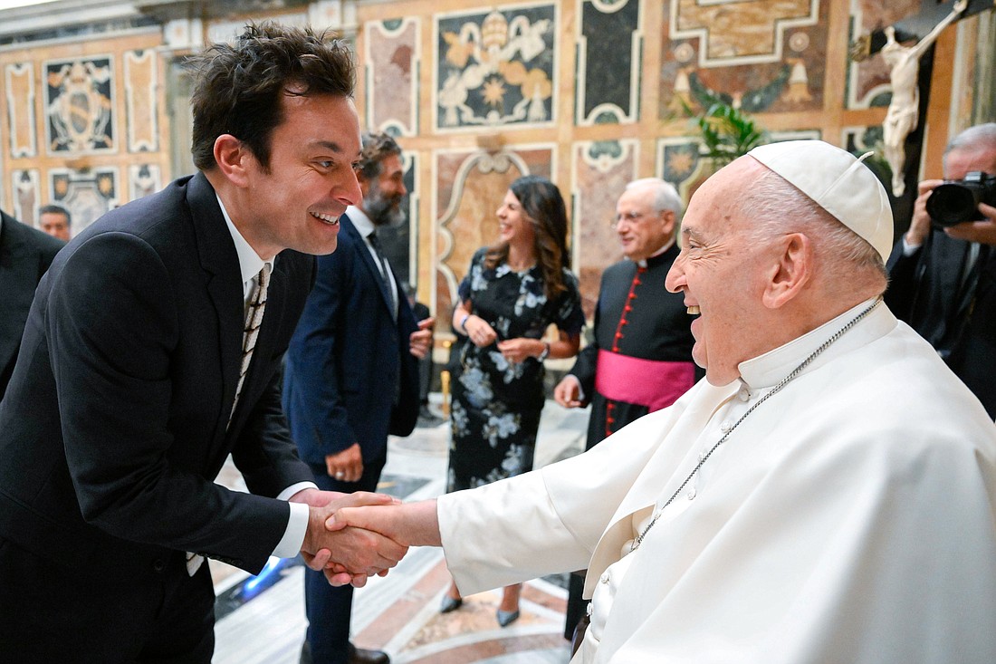 Pope Francis shakes hands with Jimmy Fallon during a meeting with comedians at the Vatican June 14, 2024. (CNS photo/Vatican Media)