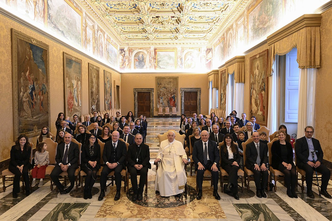 Pope Francis poses for a photo with members of a Catholic foundation that funds different initiatives in Verona, Italy, during an audience at the Vatican Jan. 18, 2025. (CNS photo/Vatican Media)