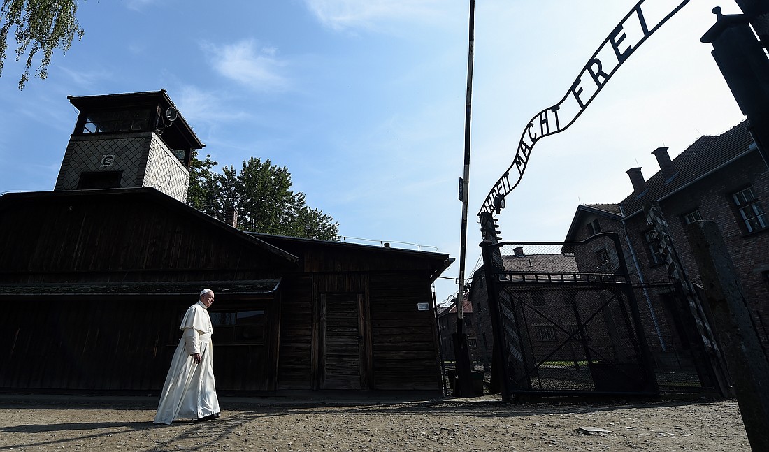 Pope Francis enters the main gate of the Auschwitz Nazi death camp in Oswiecim, Poland, July 29. (CNS photo/Alessia Giuliani, pool)) See POPE-POLAND-DEATH-CAMPS July 29, 2016.