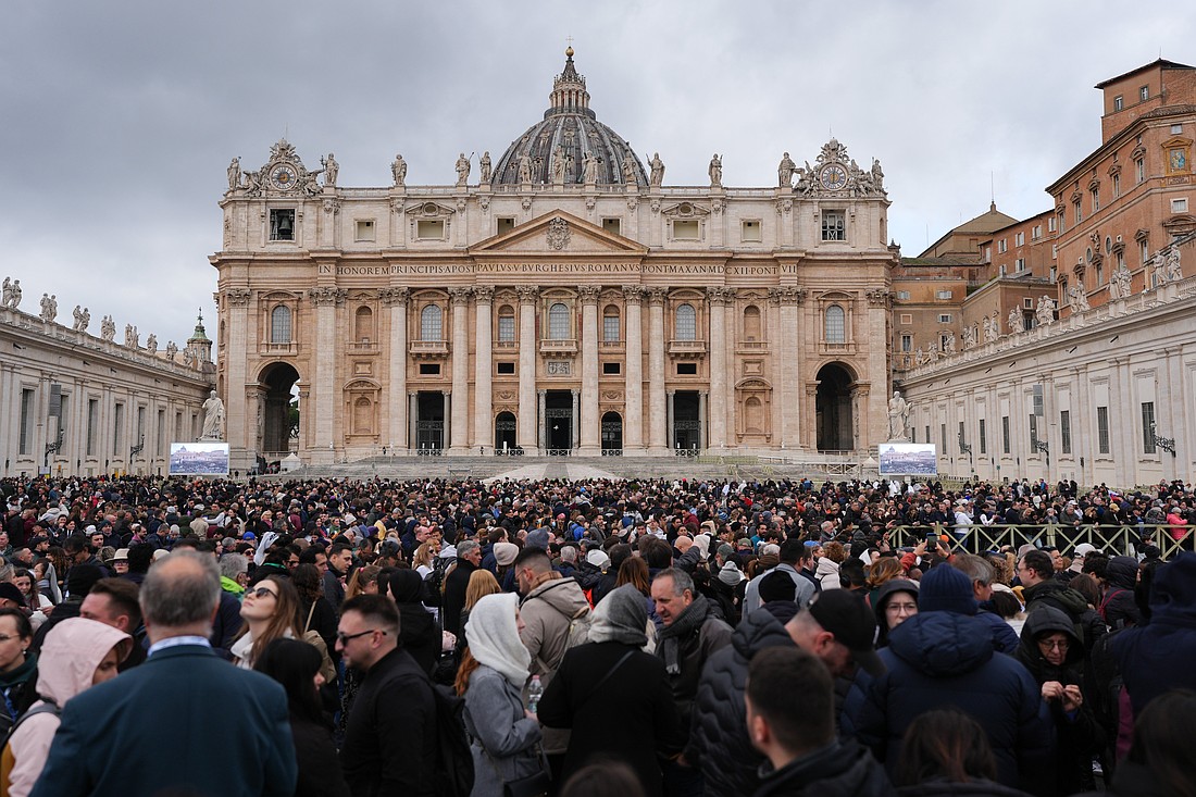 Visitors gather in St. Peter’s Square as they wait Pope Francis’ appearance for the Angelus in St. Peter’s Square at the Vatican Jan. 26, 2025. (CNS photo/Lola Gomez)