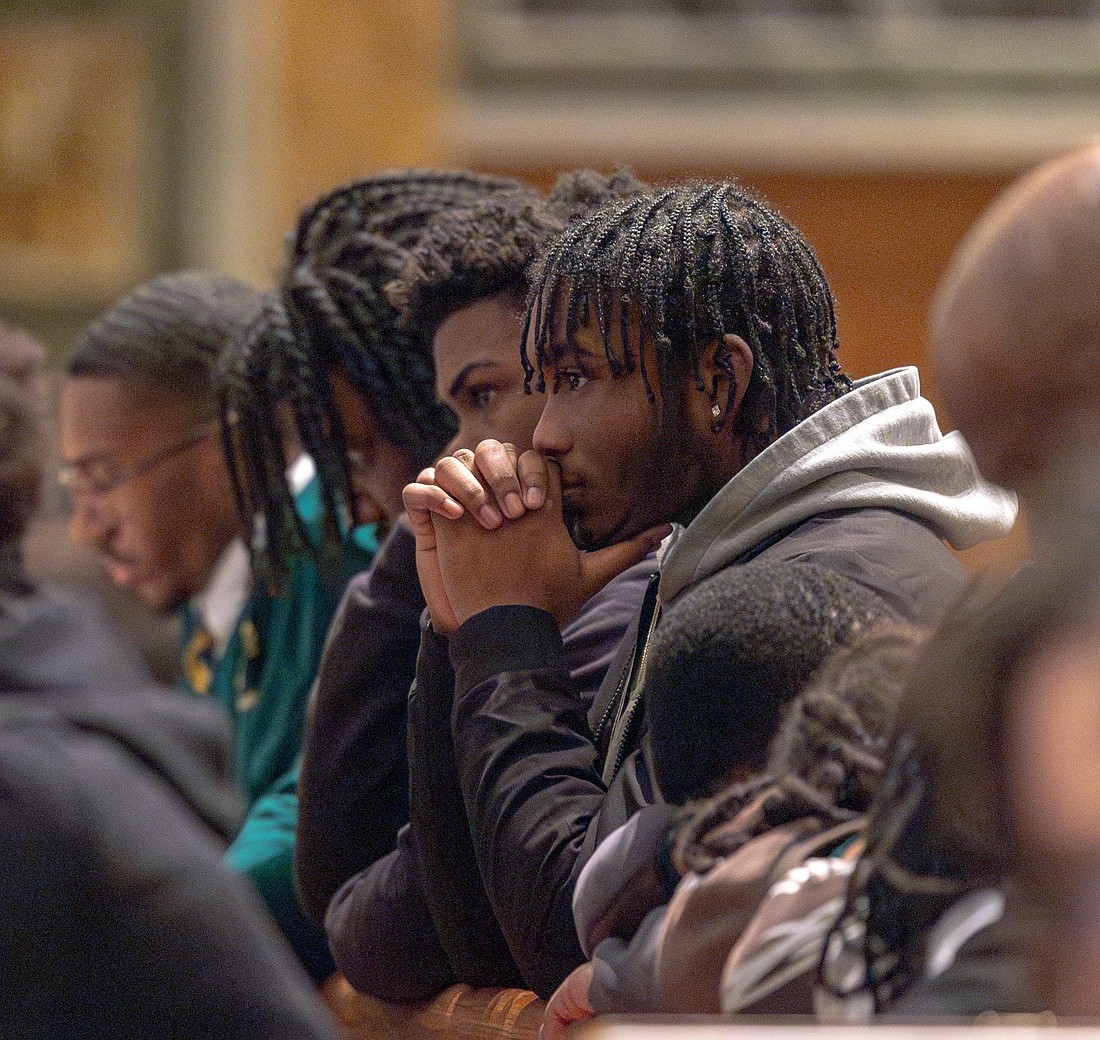 Young men pray during Eucharistic adoration that preceded the Youth Mass for Life Jan. 24, 2025, at the Cathedral of St. Matthew the Apostle in Washington. The annual Mass sponsored by the Archdiocese of Washington was celebrated before the annual March for Life in the nation's capital. (OSV News photo/Mihoko Owada, Catholic Standard)