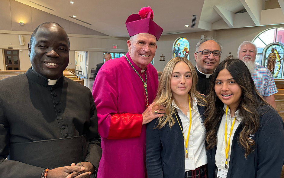 Students from Our Lady of Sorrows School, Hamilton, posed for a photo with Bishop O’Connell, his secretary Fr. Jean Felicien, and Msgr. Thomas N. Gervasio, vicar general and pastor of Our Lady of Sorrows-St. Anthony Parish, Oct. 10 after the annual Catholic Schools Mass. Bishop O’Connell celebrated the Mass to mark the start of Catholic Schools Week for the school community on Jan. 26 in Our Lady of Sorrows Church. M. Hartman photo.