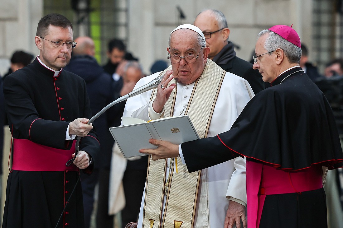 Pope Francis gives his blessing after reciting a prayer to Mary in front of the Marian statue near the Spanish Steps in Rome on Dec. 8, 2024, the feast of the Immaculate Conception. (CNS photo/Lola Gomez)