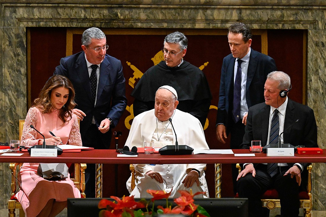 Queen Rania of Jordan, left, signs a document during the world leaders’ summit on children’s rights at the Vatican Feb. 3, 2025. Sitting and looking on are Pope Francis, center, and former U.S. Vice President Al Gore, right. Standing from left to right are: Angelo Chiorazzo, founder of the "Auxilium" social cooperative; Franciscan Father Enzo Fortunato, president of the Pontifical Committee for the World Day of Children; and Aldo Cagnoli, vice president of the same committee. (CNS photo/Vatican Media)