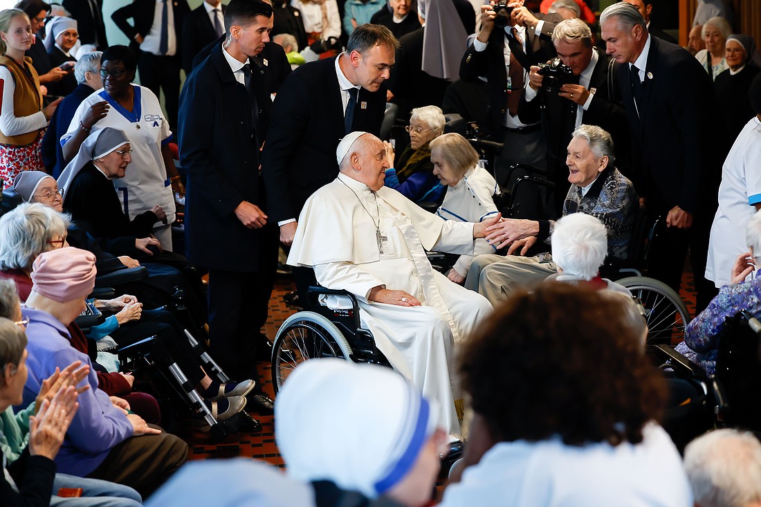 Pope Francis greets residents and staff at St. Joseph's Home in Brussels, a residence operated by the Little Sisters of the Poor for the elderly, Sept. 27, 2024. (CNS photo/Lola Gomez)