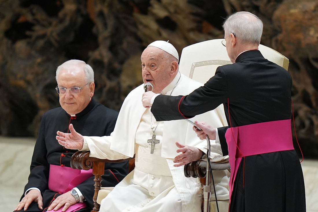 Pope Francis speaks to visitors in the Paul VI Audience Hall during his weekly general audience at the Vatican Feb. 5, 2025. The pope explained that an aide would read his catechesis on his behalf as he was still recovering from a cold. (CNS photo/Lola Gomez)