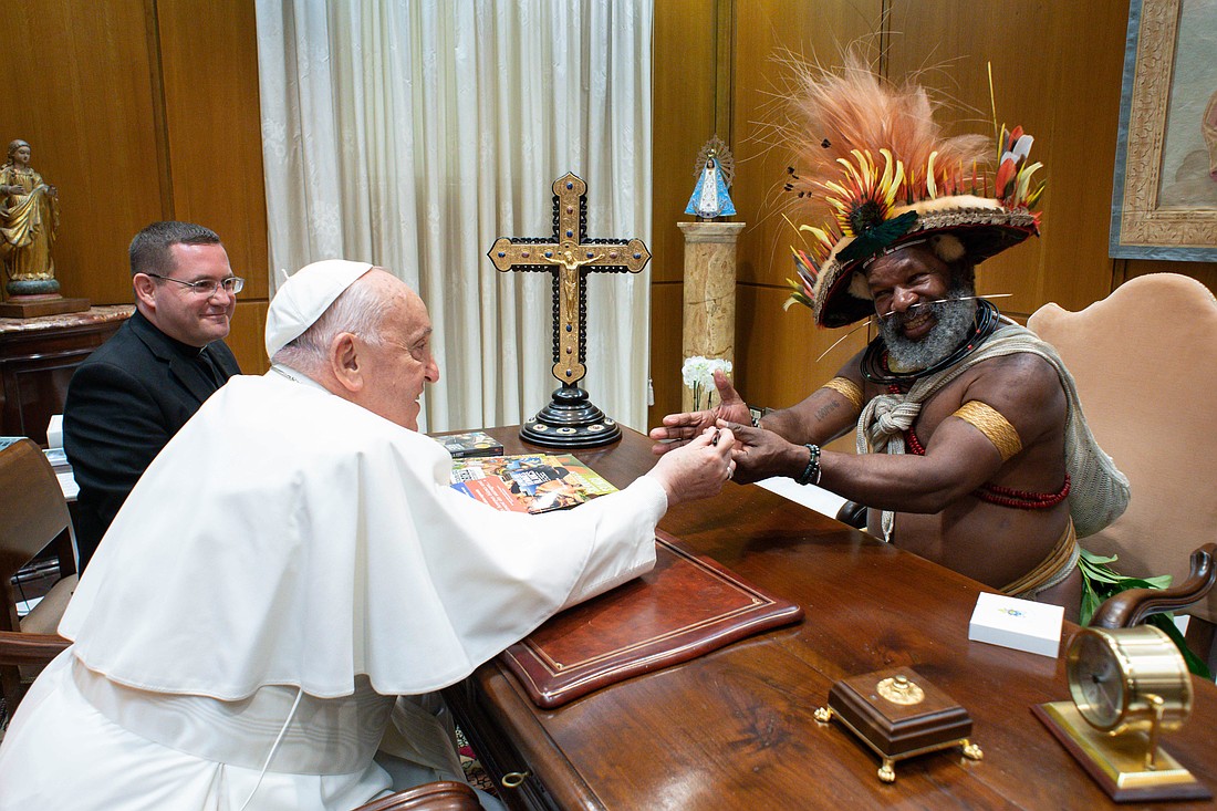 Pope Francis shares a moment with Mundiya Kepanga, a Papuan activist and leader from Papua New Guinea, at the Vatican May 8, 2024. Kepanga is known for advocating for the rights of Indigenous peoples and for raising awareness about the challenges they face, including environmental issues and land rights. (CNS photo/Vatican Media)