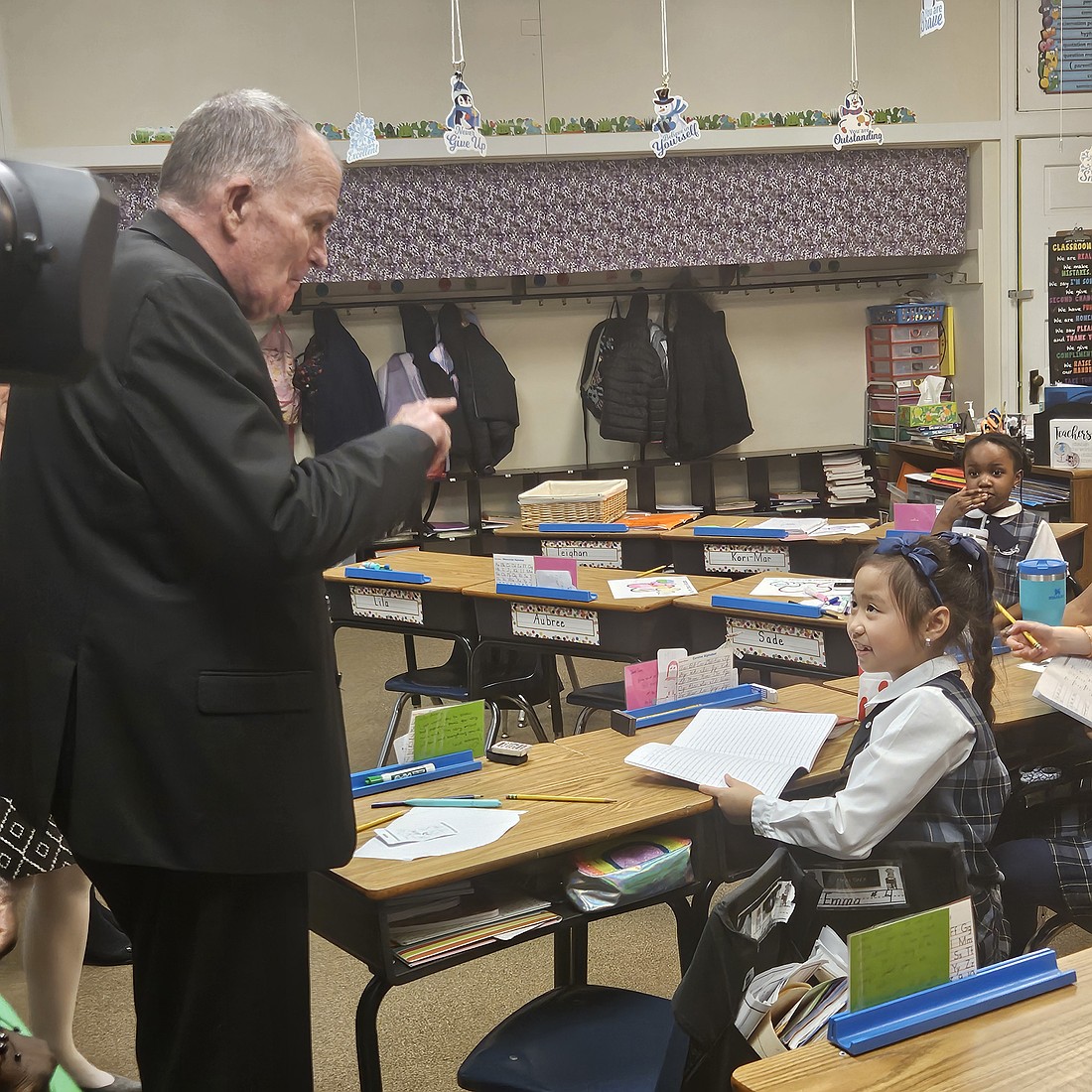 Bishop O’Connell engages in conversation with a student from Sacred Heart School, Mount Holly. Mary Stadnyk photo