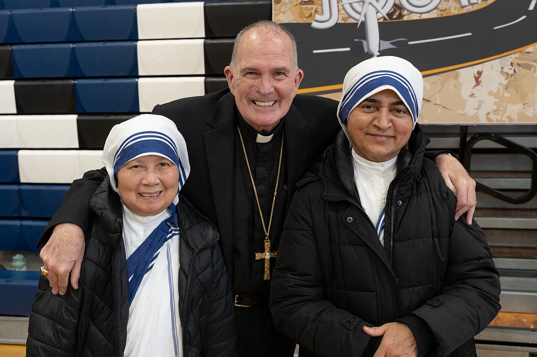 Bishop David M. O’Connell, C.M., poses for a photo with two members of the Missionaries of Charity, during his visit to the Diocesan Youth Conference Feb. 1. Bishop O’Connell recently wrote about the vital role that those in consecrated life continue to hold in the Church. Matt Marzorati photo