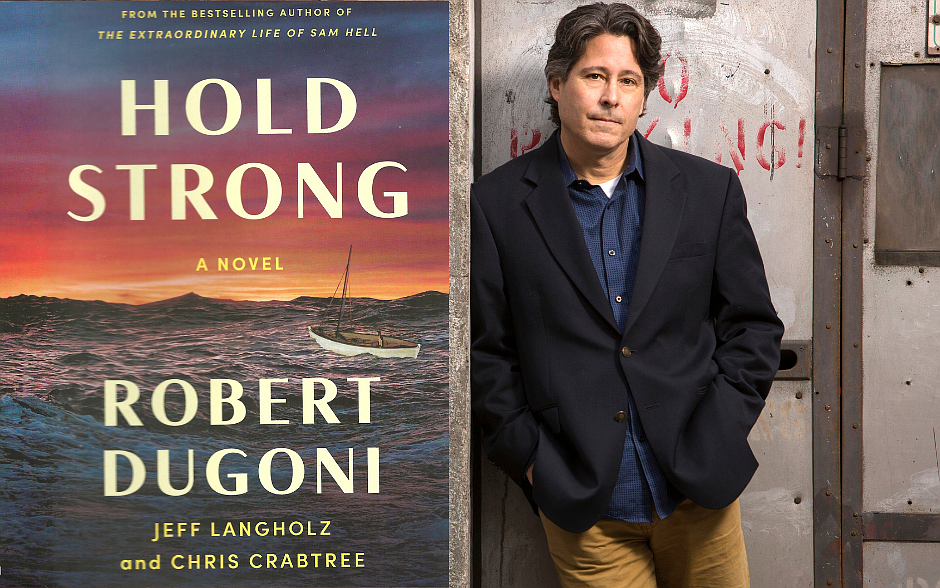 This is the cover of Robert Dugoni's new novel "Hold Strong," in which a tireless Catholic chaplain, heroically ministering to prisoners of war, begins to struggle with his faith. (OSV News photo/courtesy Mike Mastromatteo)

Robert Dugoni is author of the new novel "Hold Strong," in which a tireless Catholic chaplain, heroically ministering to prisoners of war, begins to struggle with his faith. Dugoni is pictured in an undated publicity photo. (OSV News photo/courtesy Douglas Sonders)
