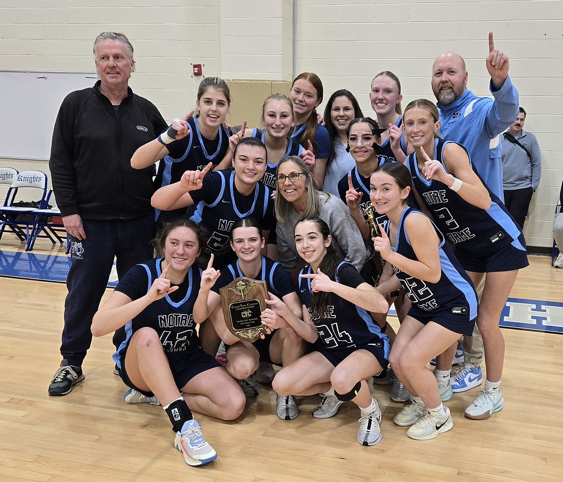 The Notre Dame High girls basketball team tells everyone who is number one after winning the inaugural Colonial Valley Conference Tournament championship at West Windsor-Plainsboro North High School Feb. 15. The Irish topped Ewing, 47-35, in the final. Rich Fisher photo