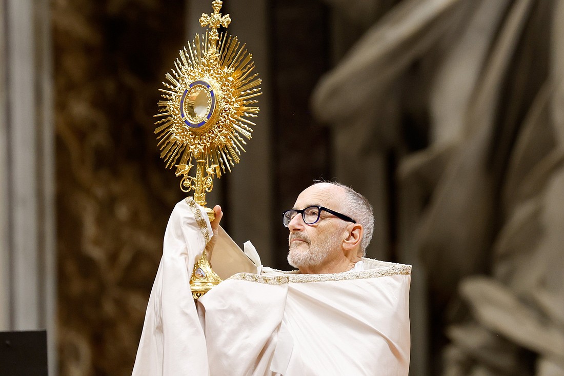 Cardinal Michael Czerny, prefect of the Dicastery for Promoting Integral Human Development, raises the Eucharist in a monstrance during eucharistic benediction at the end of a prayer service for peace in St. Peter's Basilica at the Vatican Oct. 27, 2023. (CNS photo/Lola Gomez)