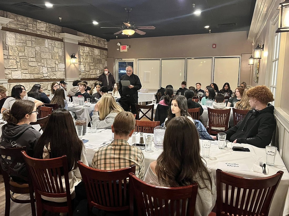 Msgr. Gervasio speaks during the recent Pizza with the Pastor offered for Confirmation candidates in Our Lady of Sorrows-St. Anthony Parish. Courtesy photo