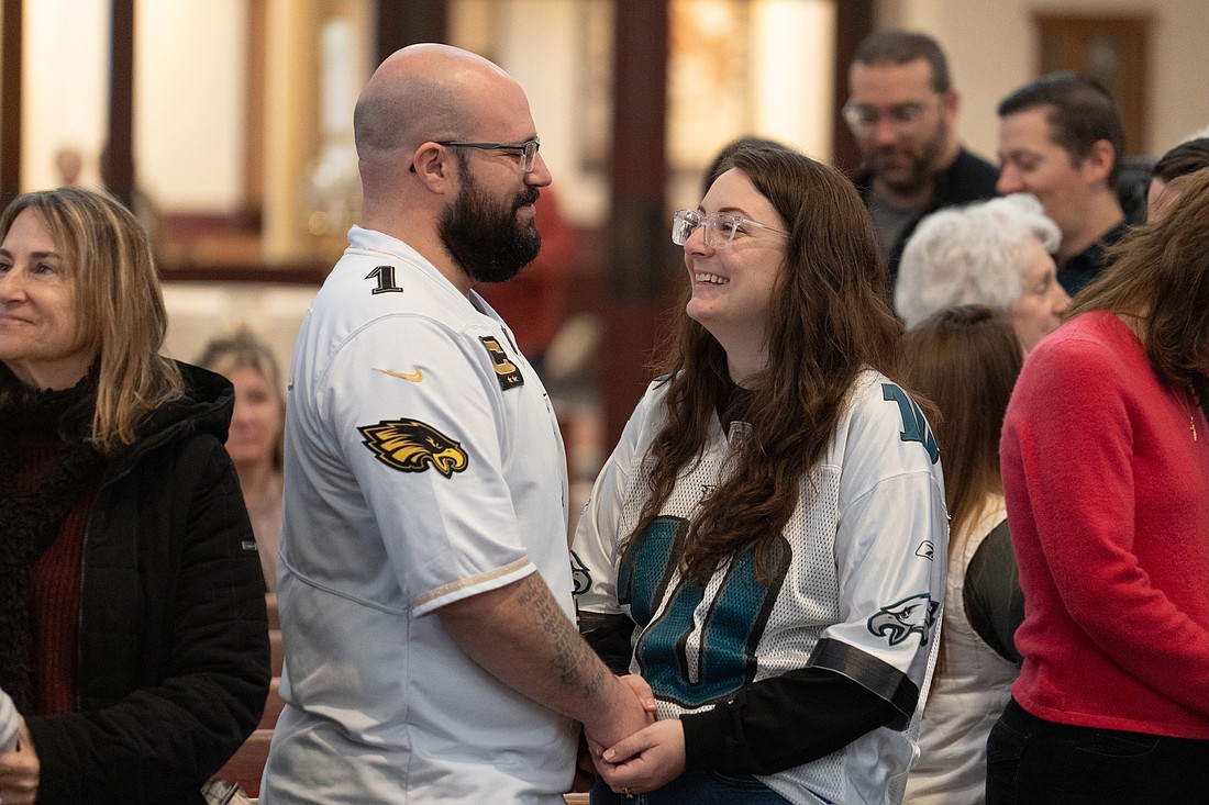 A husband and wife renew their marriage vows during a Mass celebrated in St. Mary Church, Middletown, as part of the parish's observance of World Marriage Day. Photo from St. Mary Parish Facebook page.