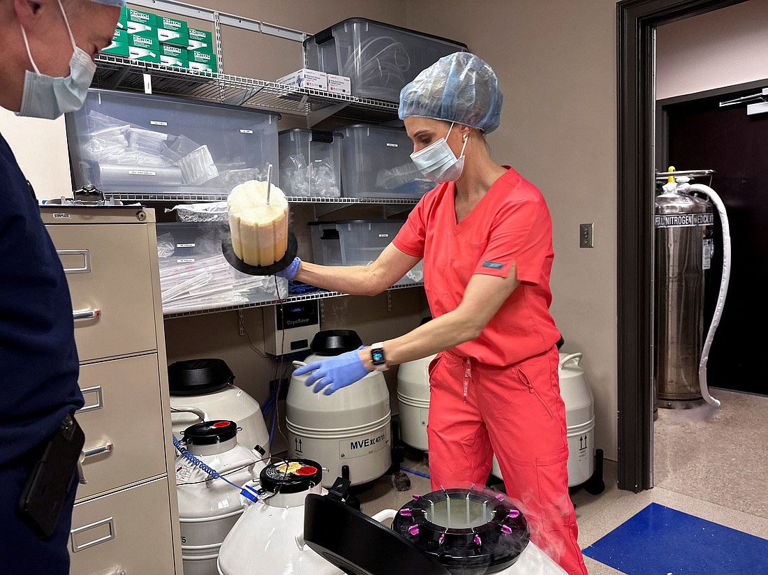 Dr. Andrew Harper, medical director for Huntsville Reproductive Medicine, P.C., looks on as Lynn Curry, nurse practitioner for Huntsville Reproductive Medicine, P.C., opens IVF cryopreservation dewar in Madison, Ala., March 4, 2024. U.S. President Donald Trump signed an executive order Feb. 19, 2025, to develop policy recommendations to expand access to and affordability of in vitro fertilization. (OSV News photo/Roselle Chen, Reuters)