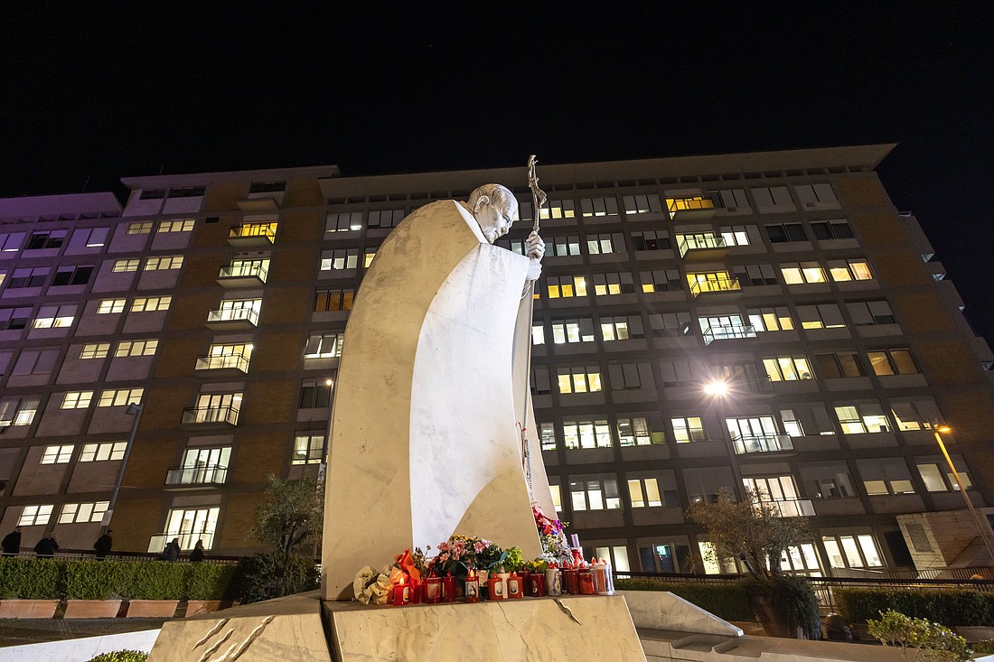 A statue of St. John Paul II stands outside the main entrance of Rome's Gemelli hospital Feb. 21, 2025. Pope Francis has been an inpatient at the hospital since Feb. 14. (CNS photo/Pablo Esparza)