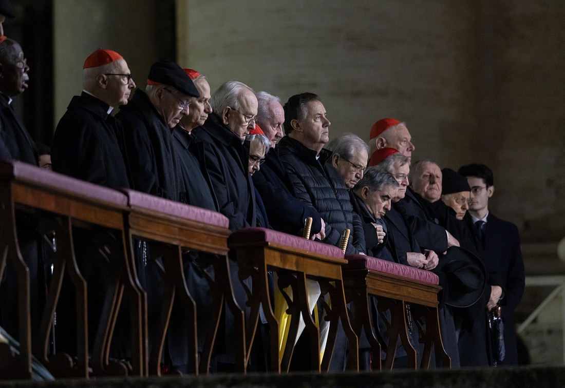 Cardinals, including Cardinal Angelo Becciu, who is appealing his conviction by a Vatican court for financial malfeasance, join Cardinal Pietro Parolin, Vatican secretary of state, in reciting the rosary for Pope Francis in St. Peter's Square at the Vatican Feb. 24, 2025. (CNS photo/Pablo Esparza)