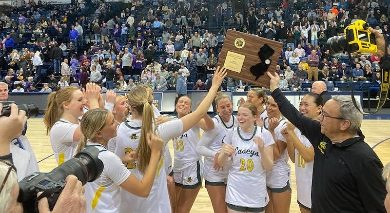 The Red Bank Catholic girls basketball team members hoist their prize after claiming their first Shore Conference Tournament title since 2013 at Monmouth University Feb. 21. Courtesy photo