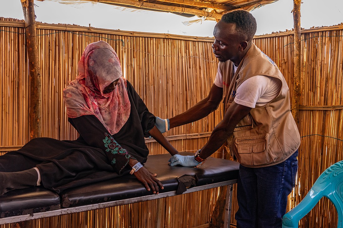 A worker with Jesuit Refugee Service seen in a 2023 photo offers physical therapy to a woman in Renk, South Sudan, as part of the response to the conflict in Sudan. A pause on U.S. foreign aid is affecting critical programs carried out by nongovernmental organizations like JRS. (OSV News photo/courtesy JRS)