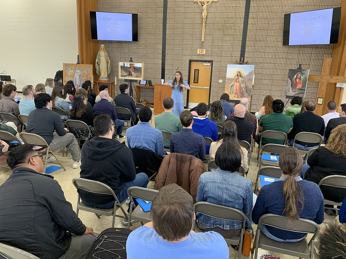 Catholic sacred artist Kate Capato talks to young adults about the inherent beauty in God's creation, especially the human person, during the March 1 young adult retreat in St. Thomas More Parish, Manalapan. EmmaLee Italia photo