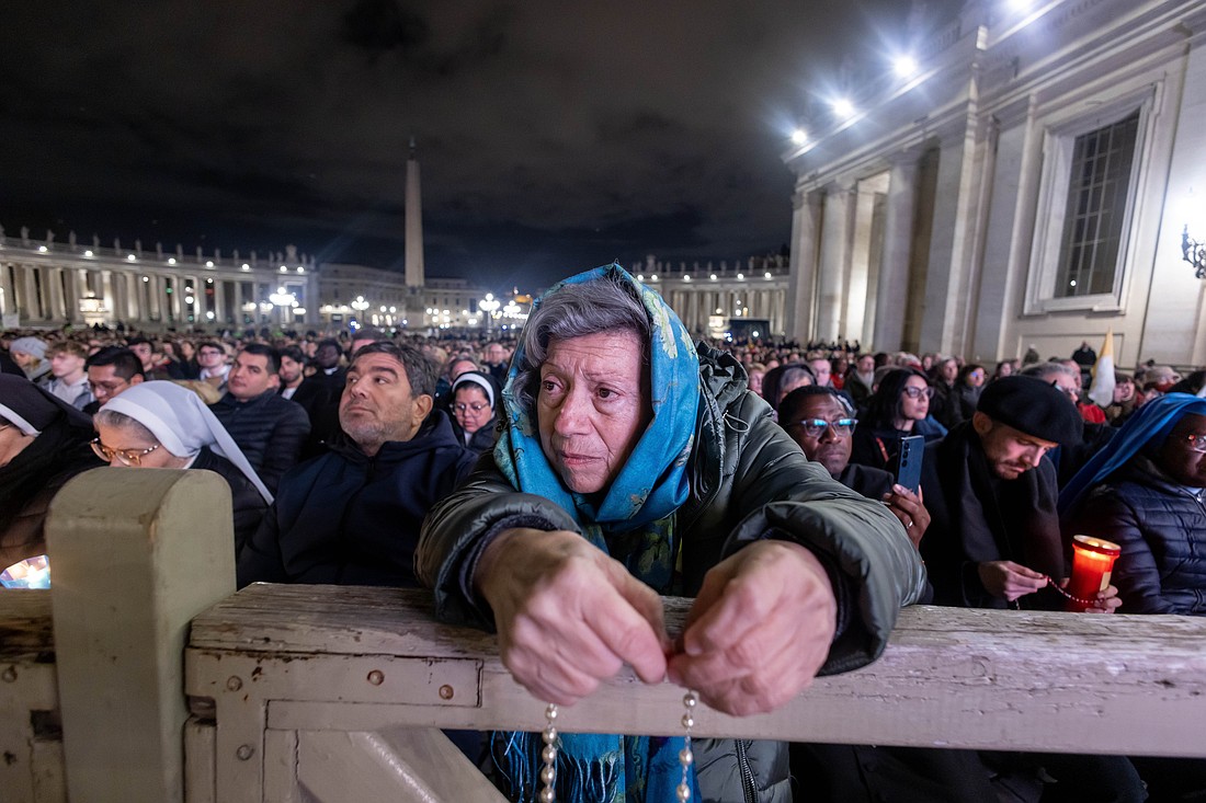 People join Cardinal Víctor Manuel Fernández, prefect of the Dicastery for the Doctrine of the Faith, for the recitation of the rosary for Pope Francis in St. Peter’s Square at the Vatican Feb. 28, 2025. Pope Francis has been hospitalized since Feb. 14 for double pneumonia. (CNS photo/Pablo Esparza)