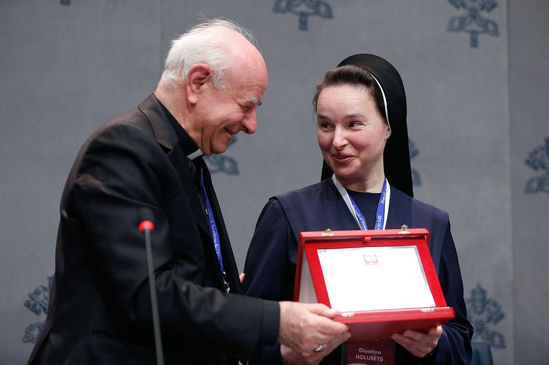 Archbishop Vincenzo Paglia, president of the Pontifical Academy for Life, presents the Guardian of Life Award to Sister Giustina Olha Holubets, a Ukrainian geneticist at the University of Lviv, during a news conference at the Vatican March 3, 2025. She is a member of the Congregation of the Sisters Servants of Mary Immaculate and she helped found the "Imprint of Life," a perinatal palliative care center in Ukraine. (CNS photo/Lola Gomez)