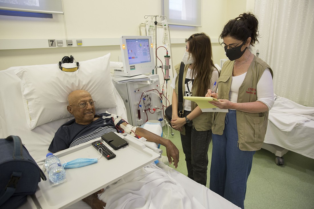 A patient is pictured with staff of Catholic Near East Welfare Association on the dialysis floor at the Lebanese Hospital Geitaoui in Beirut June 18, 2021. CNEWA coordinated worldwide Catholic aid from partners to help repair the hospital after the August 2020 Beirut port blasts. (CNS photo/CNEWA, courtesy of Lebanese Hospital Geitaoui-UMC)