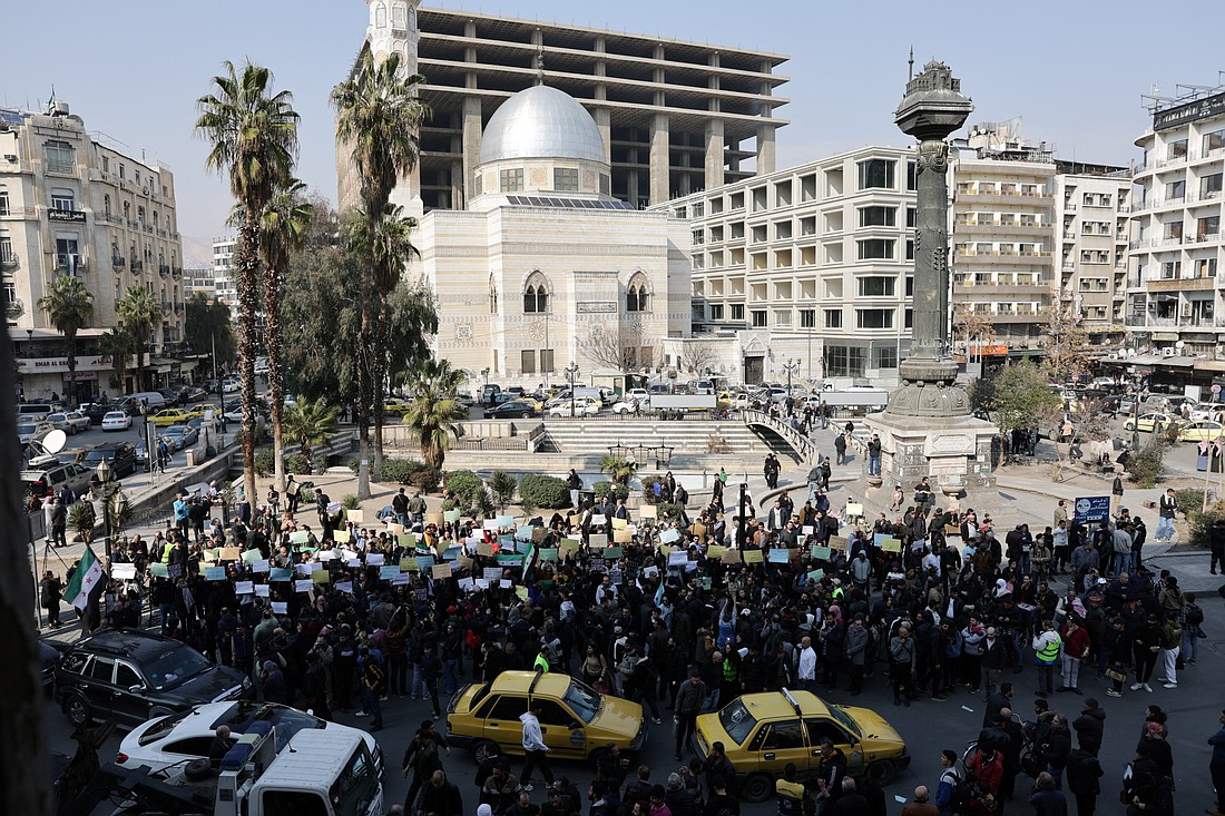 People demonstrate in Marjeh Square in Damascus, Syria, March 9, 2025, to protest the killing of civilians and security forces linked to Syria's new rulers, following clashes between the forces loyal to the new administration and fighters from Bashar Assad's Alawite sect. (OSV News/Khalil Ashawi, Reuters)