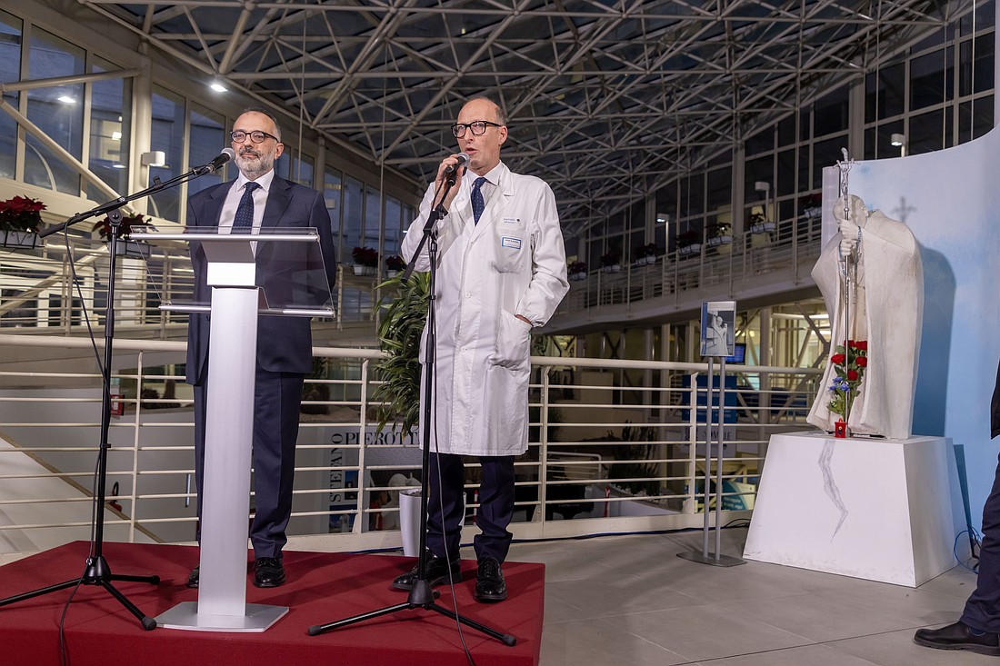 Dr. Sergio Alfieri, director of medical and surgical sciences at Rome's Gemelli hospital, speaks to the press at the hospital Feb. 21, 2025. Looking on is Dr. Luigi Carbone, Pope Francis' personal physician. (CNS photo/Pablo Esparza)