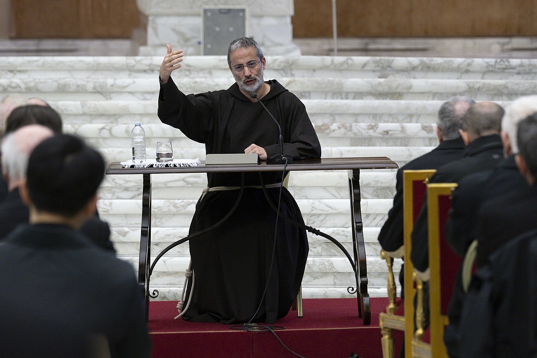 Capuchin Father Roberto Pasolini, preacher of the papal household, leads a meditation during a Lenten retreat for cardinals and senior officials of the Roman Curia in the Paul VI Audience Hall at the Vatican March 14, 2025. (CNS photo/Vatican Media)