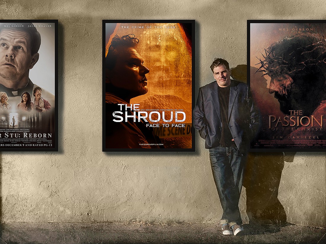 Princeton media entrepreneur Robert Orlando stands next to a movie poster of his film "The Shroud: Face to Face." Photo courtesy of Nexus Media