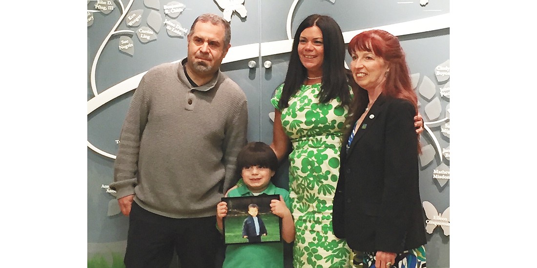 Dorothea Duffy of St. Joseph Parish in Lincoln Park had been suffering from kidney failure for four years before undergoing a lifesaving transplant in 2014. She received two small but suitable kidneys from Ben Diamond, a 2-yearold boy who died of complications from encephalitis and the flu. Duffy (right) meets Ben’s family for the first time in 2016. They are from the left: Michael, Ben’s father; Jake, his brother (holding a photo of Ben); and Susan, his mother. Courtesy photo