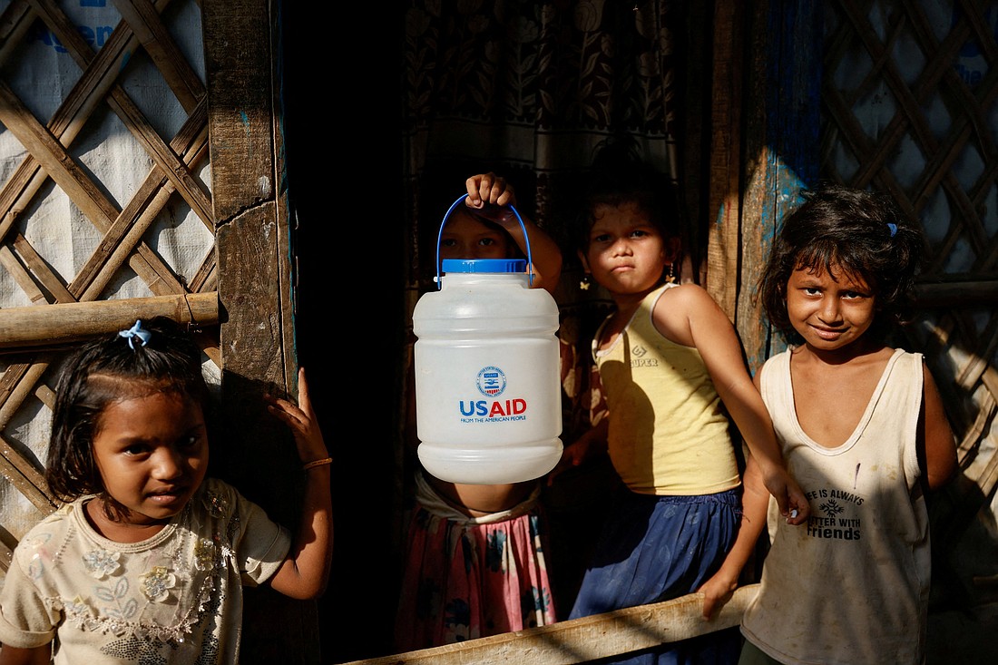 A Rohingya refugee girl holds a jar with U.S. Agency for International Development logo imprinted, at the refugee camp in Cox's Bazar, Bangladesh, March 16, 2025. The Trump administration moved March 28 to formally close USAID and fold remaining functions into the State Department. (OSV News photo/Mohammad Ponir Hossain, Reuters)