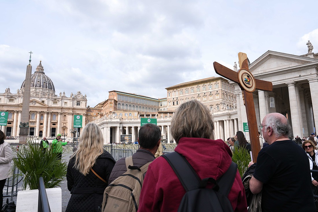 A group of pilgrims walks toward St. Peter's Square at the Vatican on their way to the Holy Door of St. Peter's Basilica April 9, 2025. Pope Francis is convalescing and did not hold his Wednesday general audience to greet the pilgrims. (CNS photo/Lola Gomez)